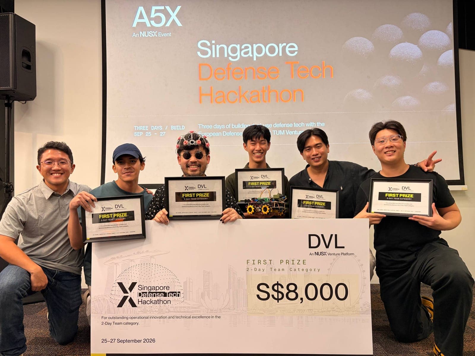 Team NeuroMech with the S$8,000 first prize cheque and certificates